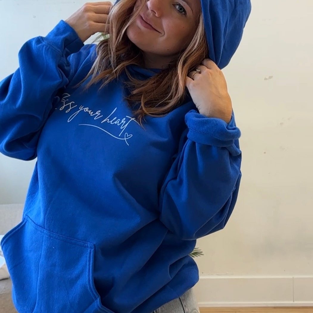 Bless your heart white writing on blue hoodie