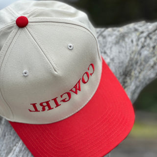 Cap with 'COWGIRL' text on a red and beige background