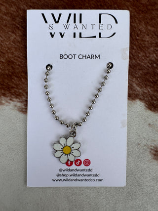 Boot charm with a daisy design on a branded card